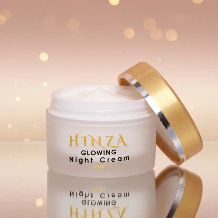 Hinza Glowing Night Cream jar with gold lid on a soft pink background